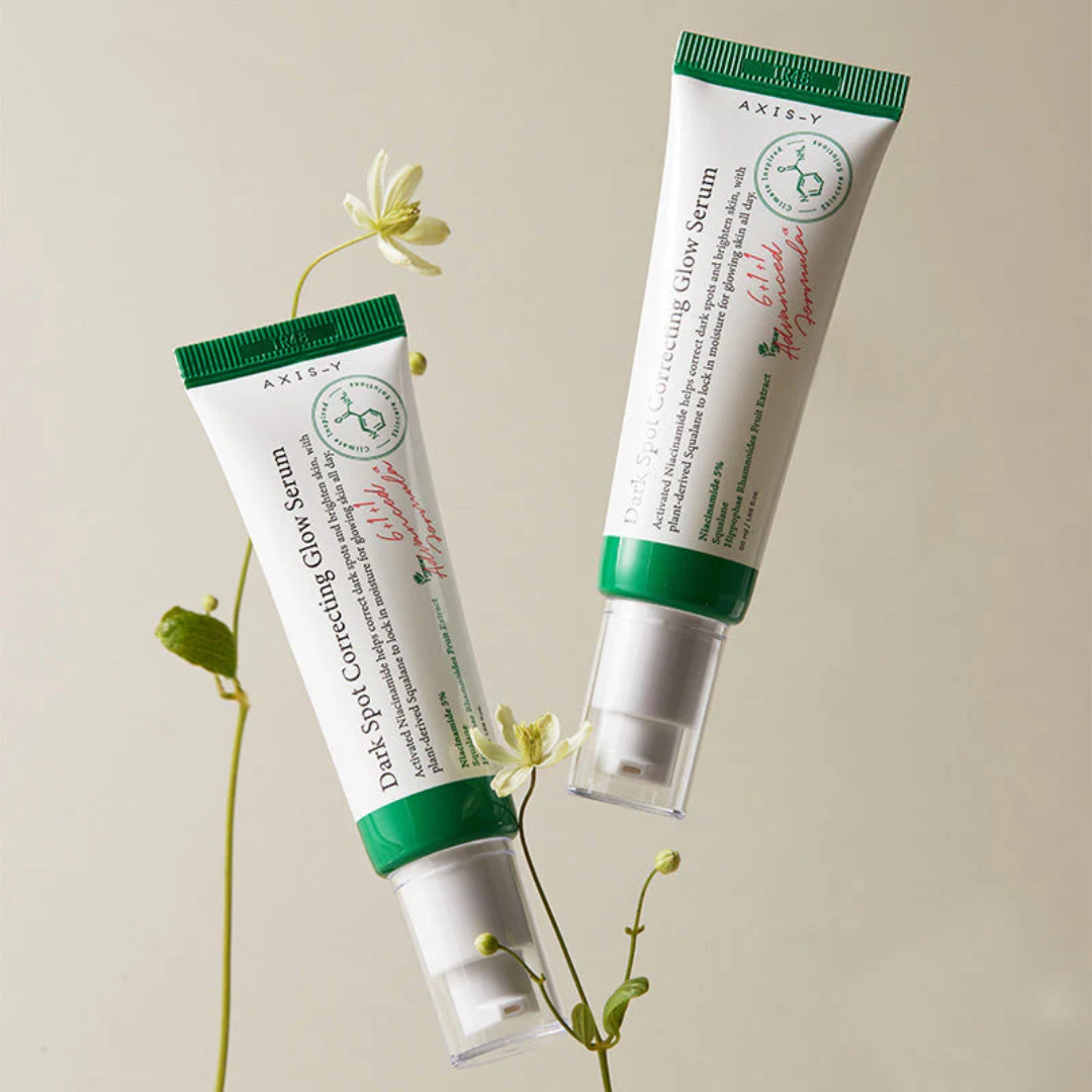 Two tubes of Axis-Y Dark Spot Correcting Glow Serum with a light background