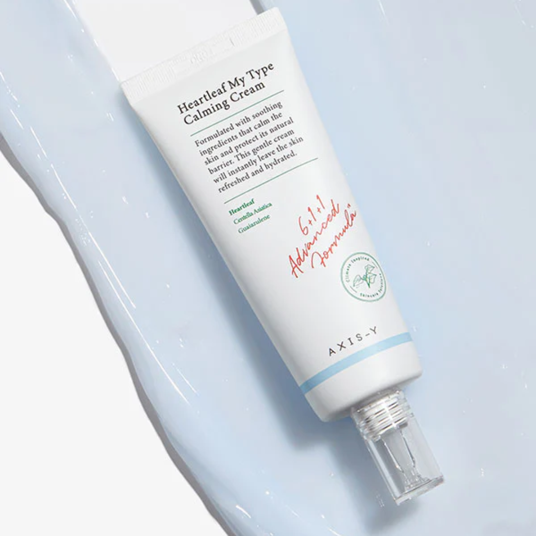Axis-Y Calming Cream bottle on a light blue background