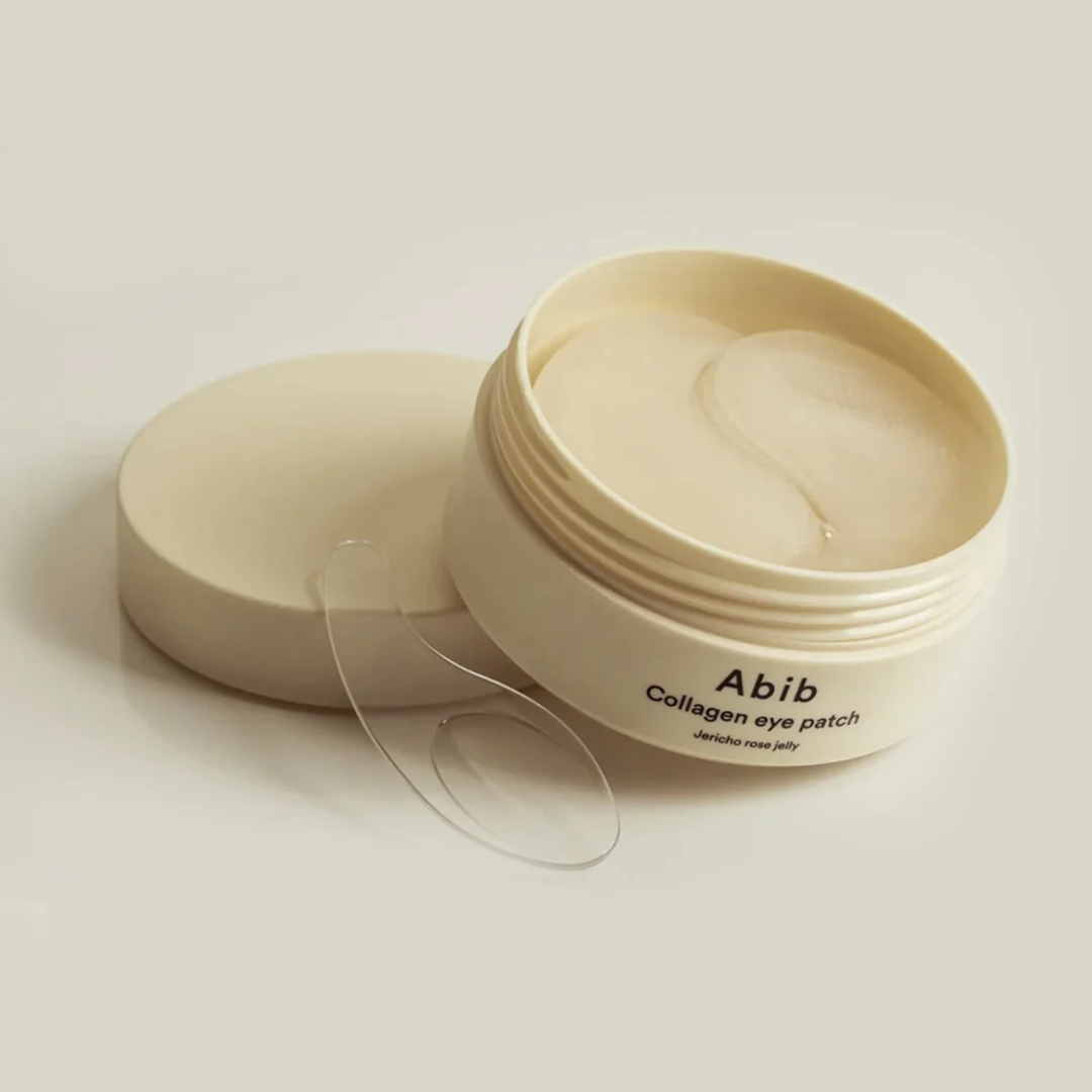 Collagen eye patch container with a lid open on a light background