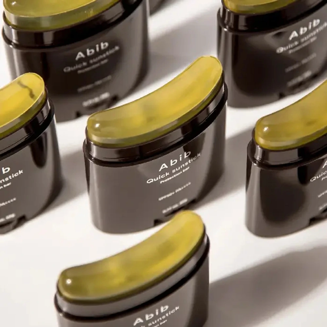 Multiple Abib quick sunstick products on a white surface