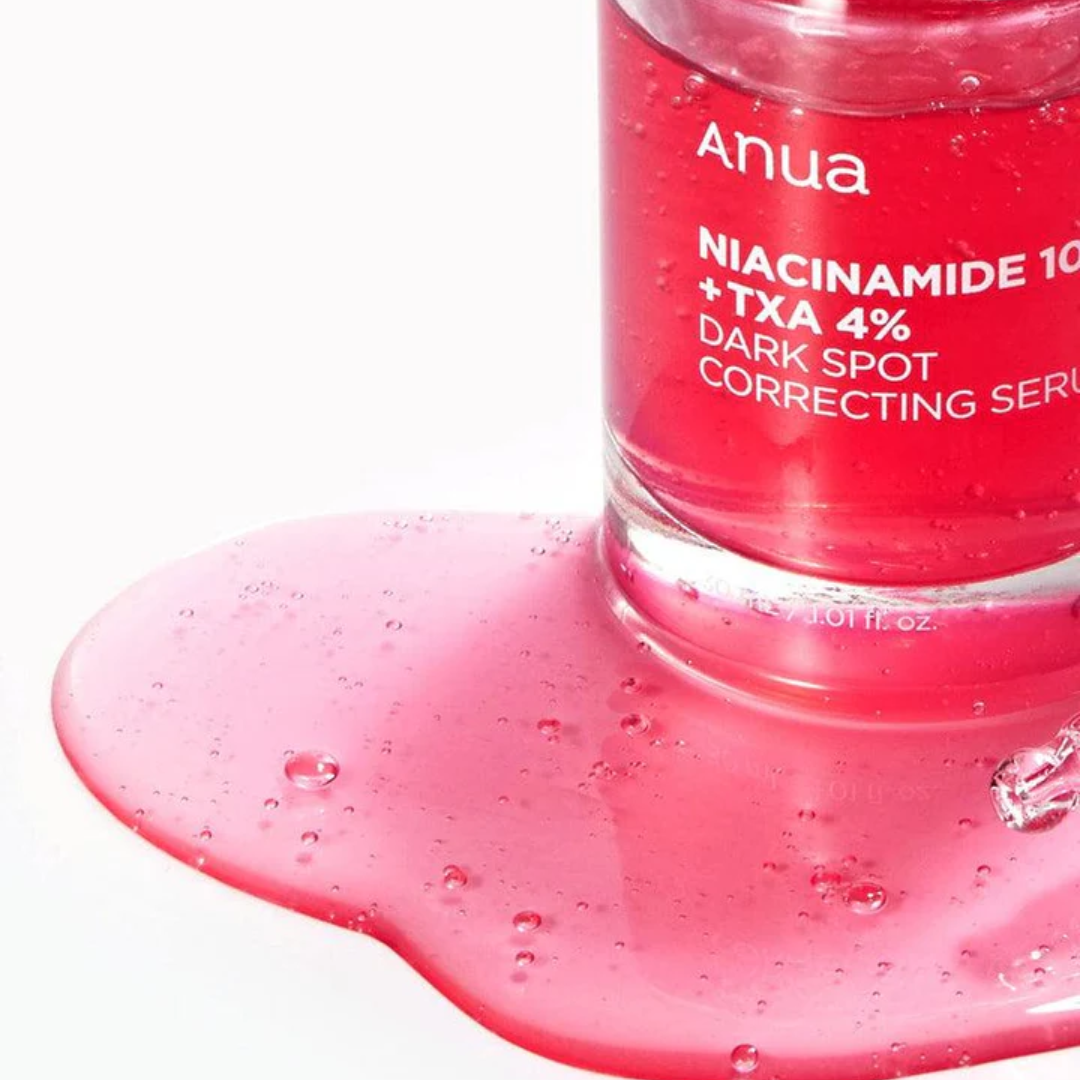 Anua Niacinamide 10 + TxA 4% dark spot correcting serum with pink liquid on a white background