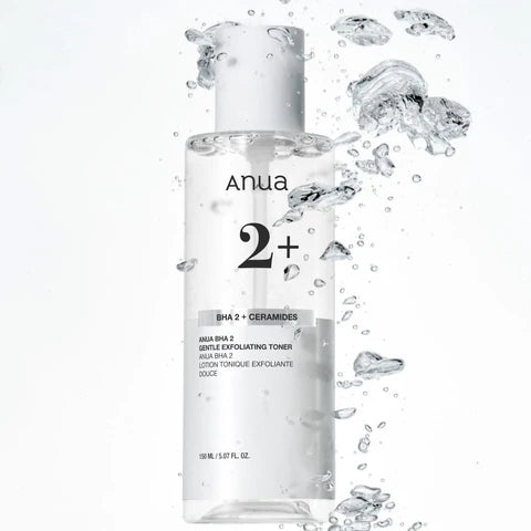 Anua skincare product with water droplets on a white background