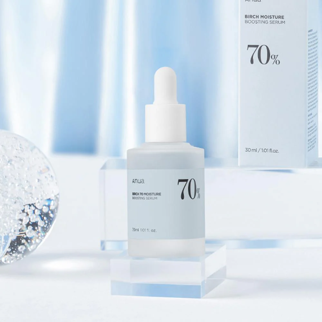 Skincare serum bottle with dropper on a light blue background