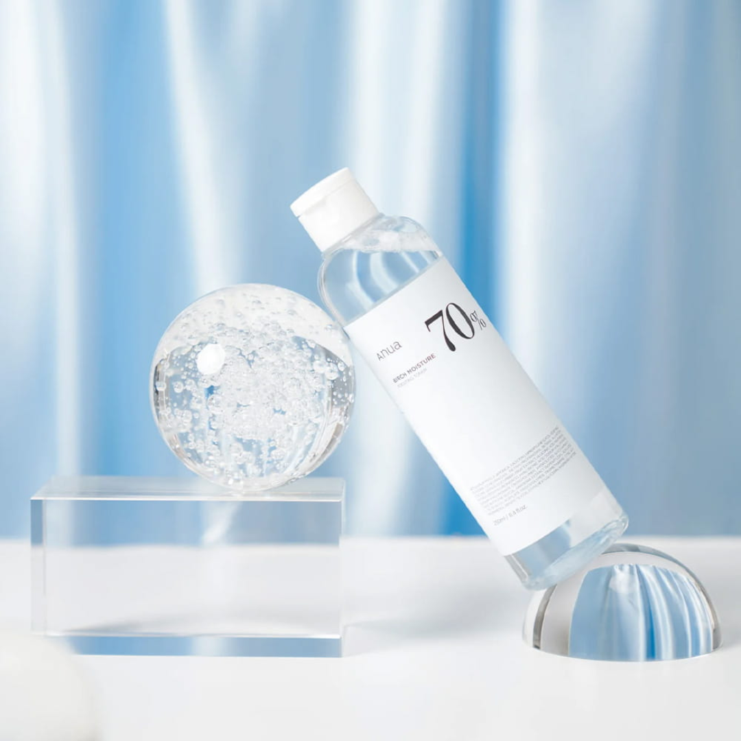 Bottle of 704 water with a crystal ball on a light blue background