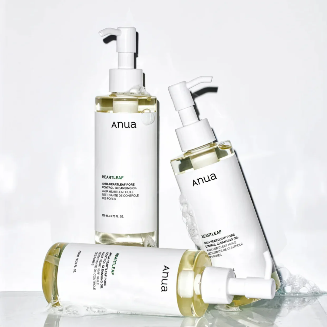 Three bottles of Anua skincare products on a white background