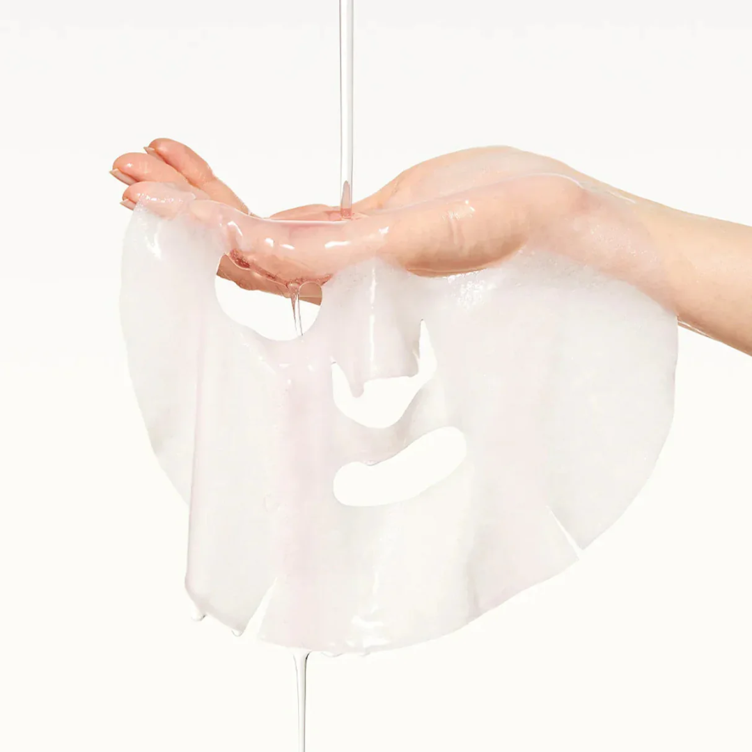 Person holding a white sheer fabric with a plain background