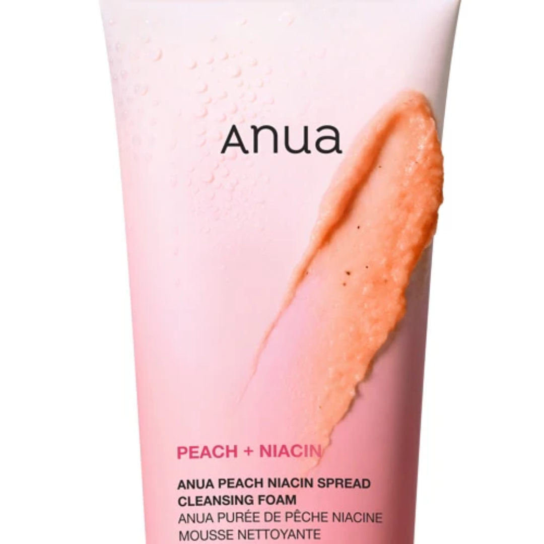 Anua Peach + Niacin cleansing foam tube with peach-colored foam on a white background