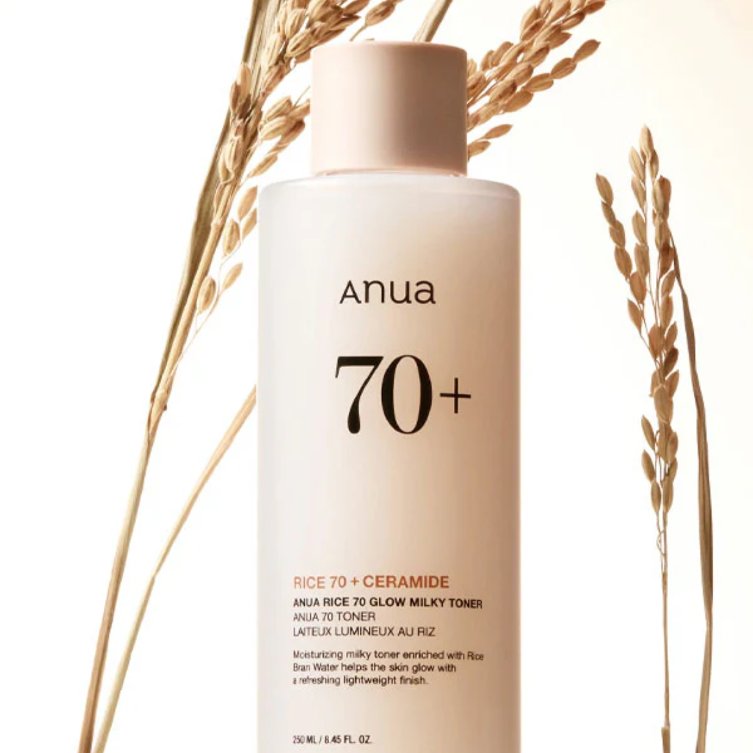 Anua 70+ skincare product with rice and wheat stalks on a light background