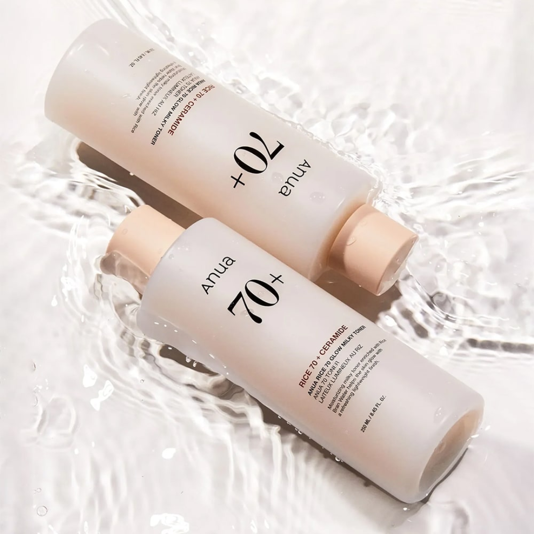 Two skincare bottles labeled 'Anua' on a light background