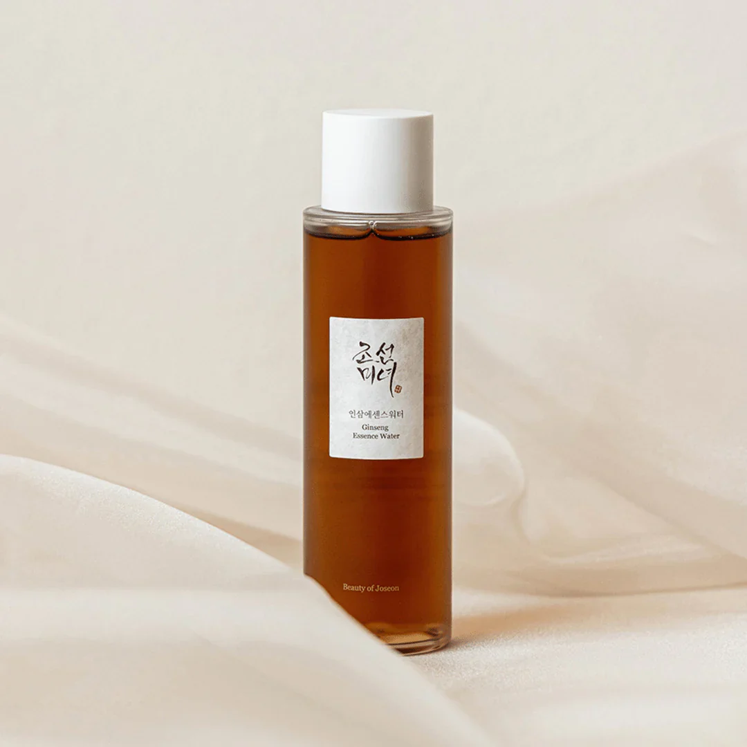 Bottle of skincare product with a white cap on a beige background