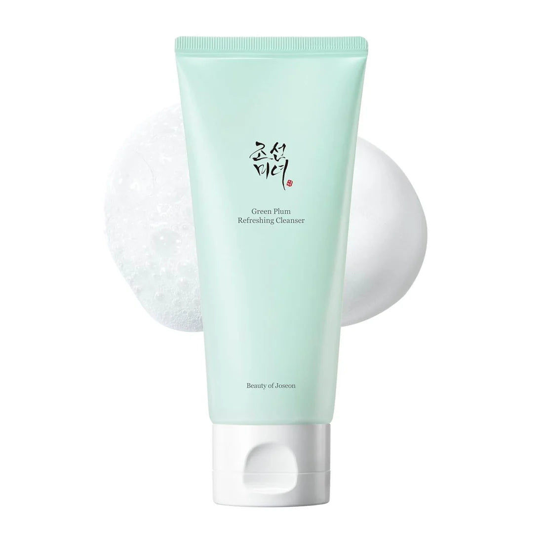 Green Plum Cleanser bottle with foam on a white background