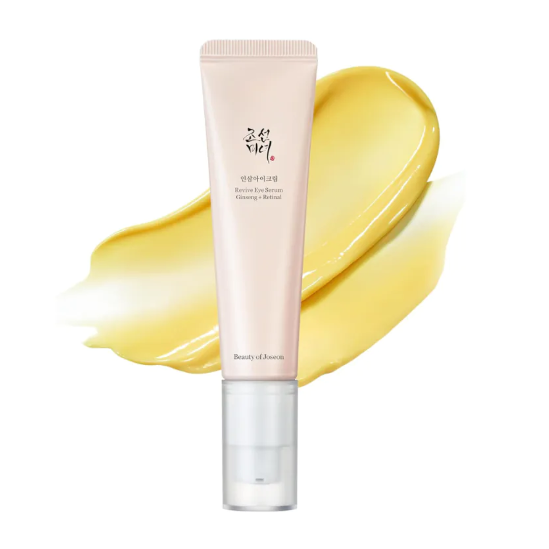 Beauty product tube with yellow cream on a white background