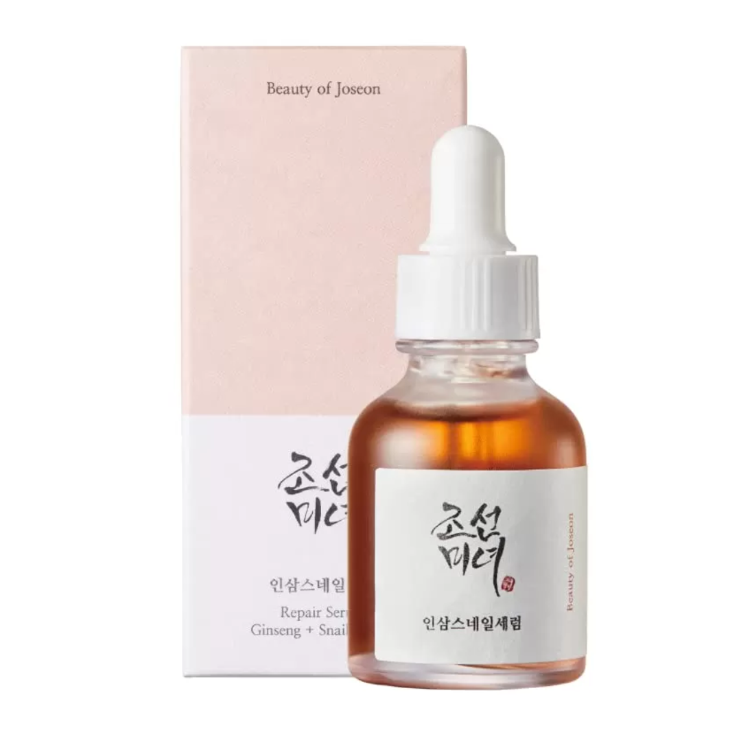 Skincare serum bottle with dropper and packaging on a white background