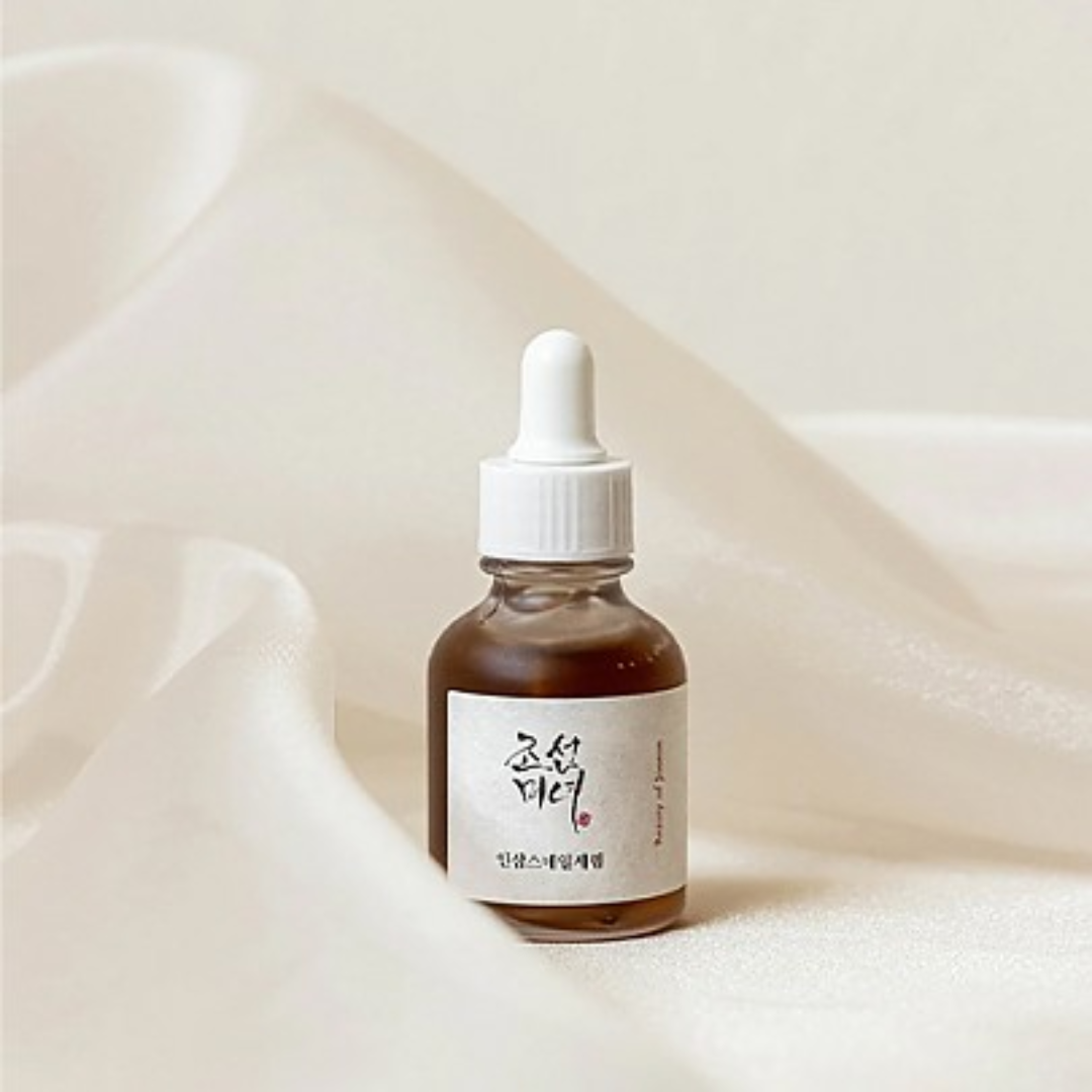 Bottle of skincare serum with dropper on a soft beige background