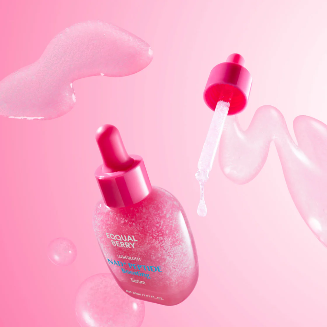 Pink skincare serum bottle with dropper on a pink background