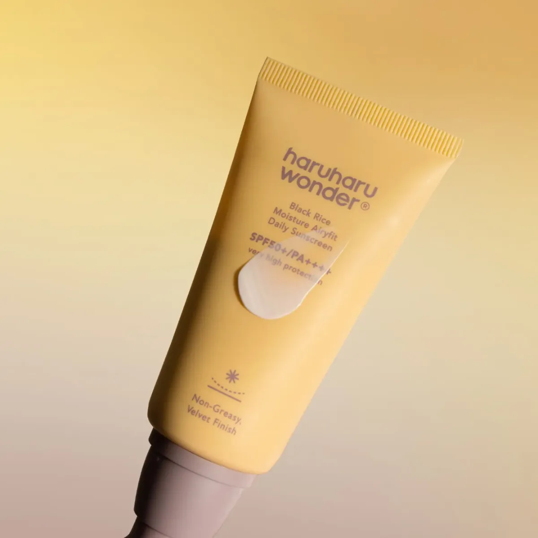 Haruharu Wonder sunscreen tube on a yellow background