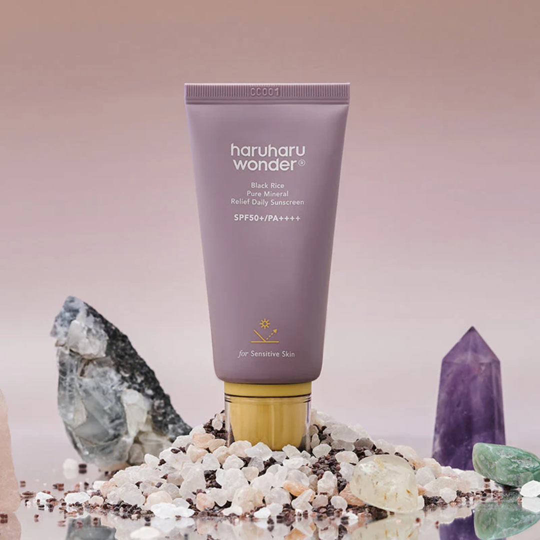 Tube of haruharu wonder sunscreen with crystals in the background
