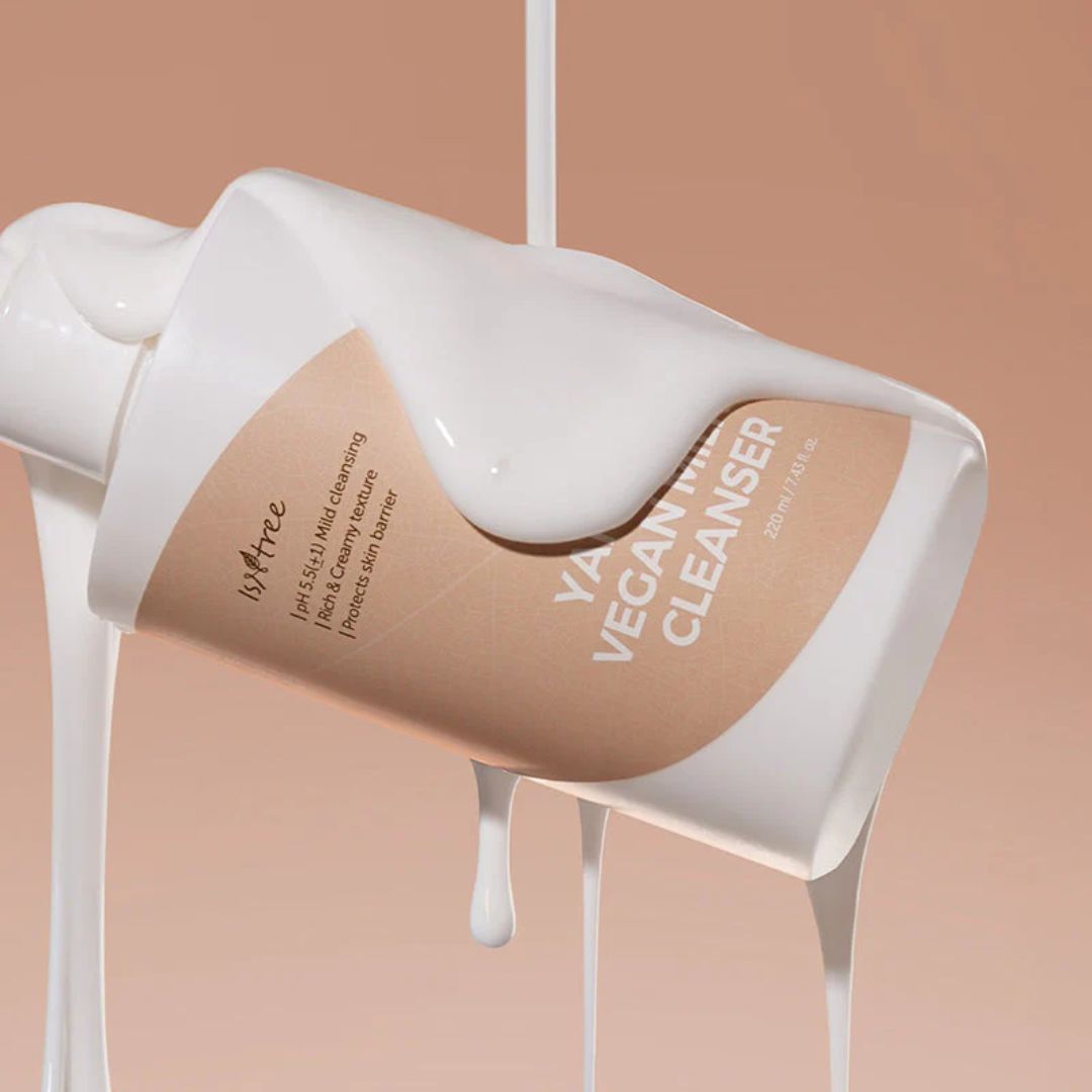 Vegan cleanser bottle with beige label on a beige background