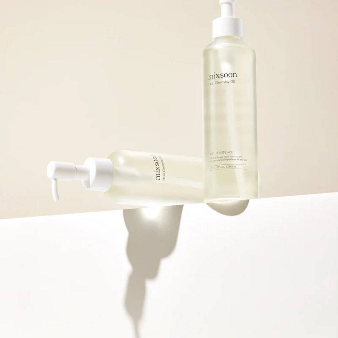 Two bottles of Mixsoon skincare products on a beige background