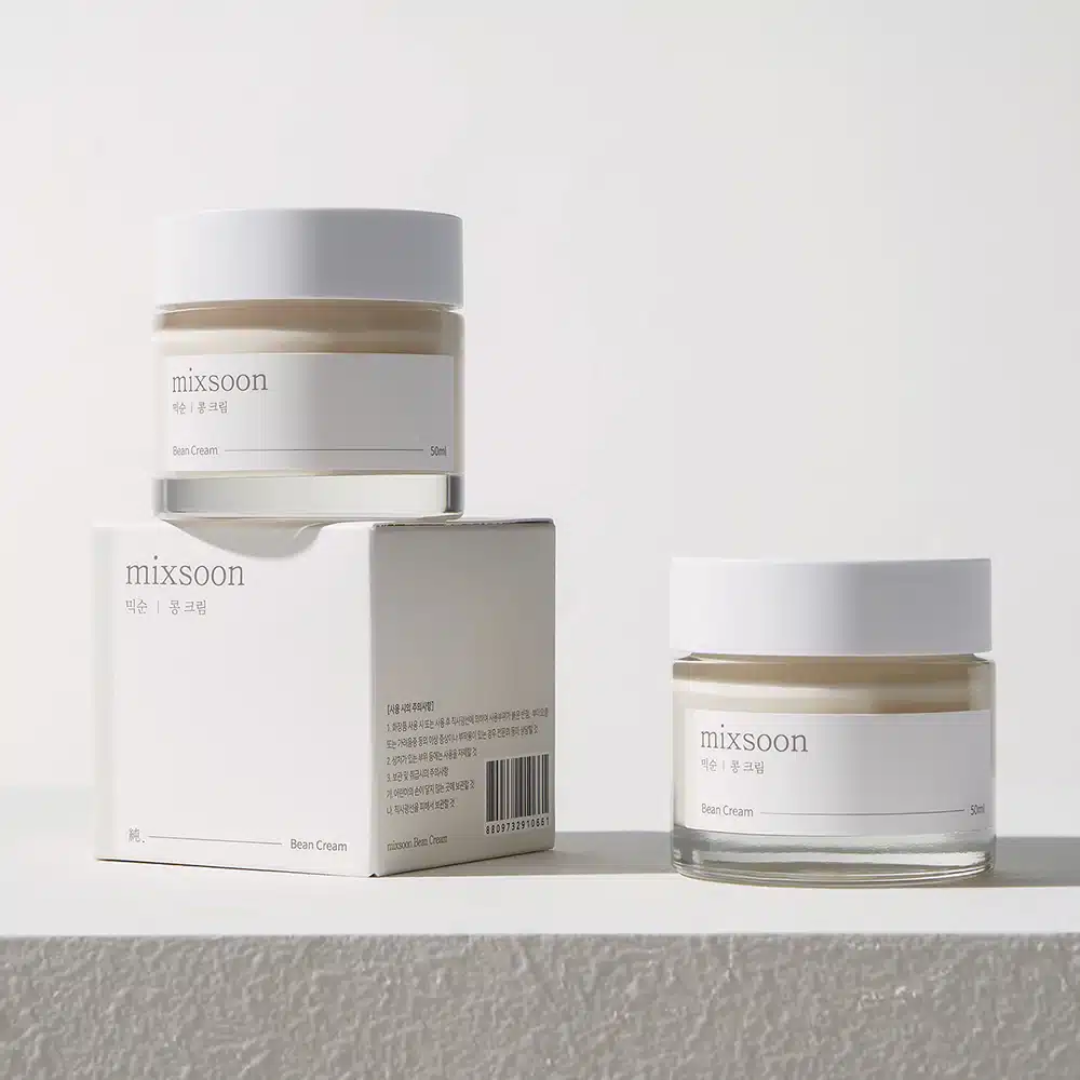 Two jars of 'mixsoon' cream and its packaging on a light gray background