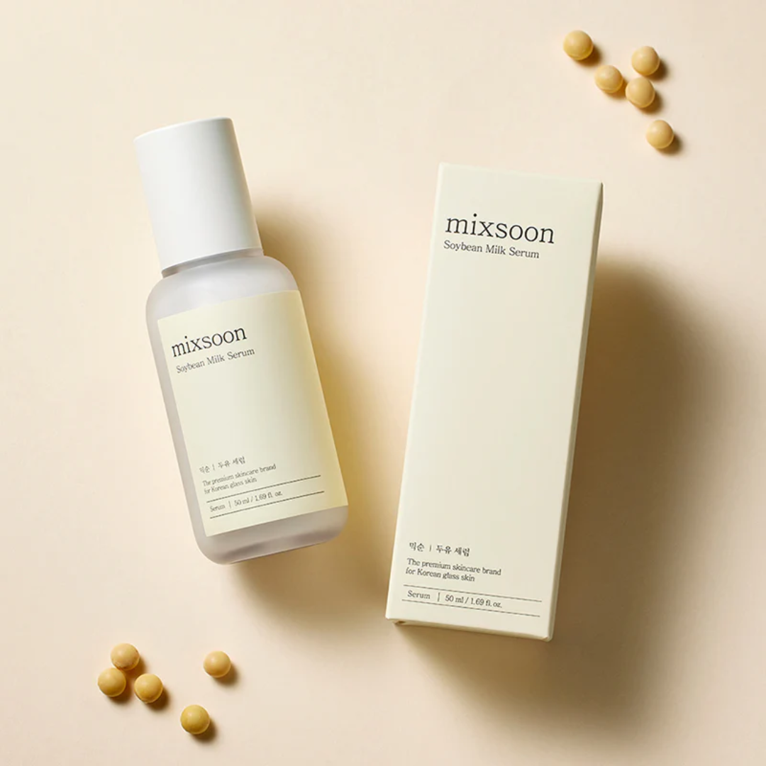 Mixsoon soybean milk serum bottle and packaging on a beige background with scattered soybeans.