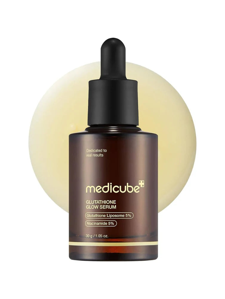 Medicube Serum bottle with yellow liquid on a white background