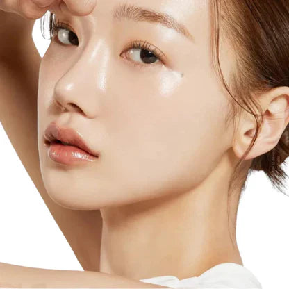 Womans' clear face with glow on a white background
