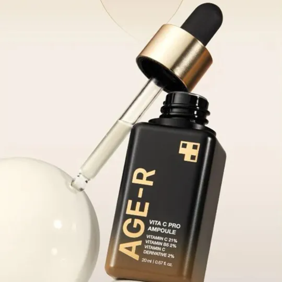 AGE-R skincare ampoule bottle with dropper on a light background