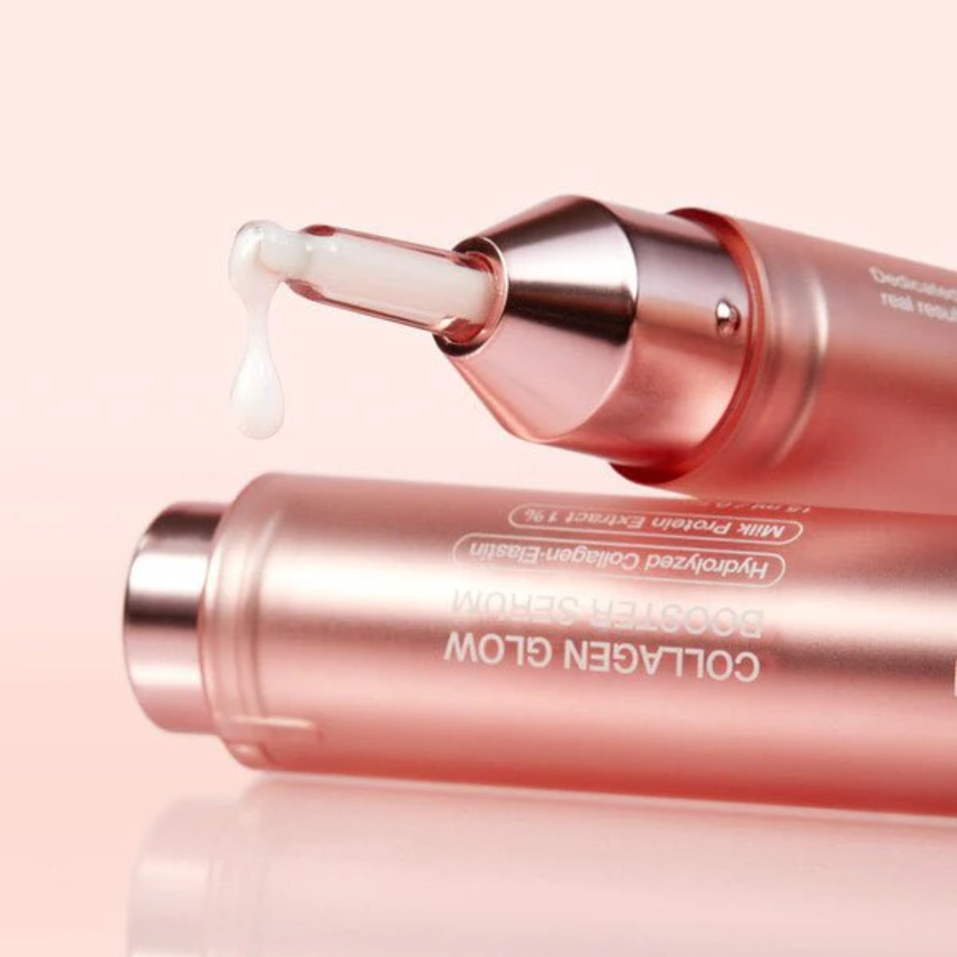 Pink skincare serum bottle with dropper on a light pink background
