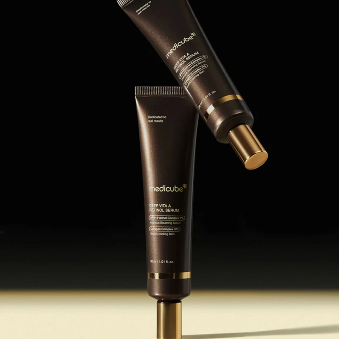 TwoMedicube skincare products on a black background