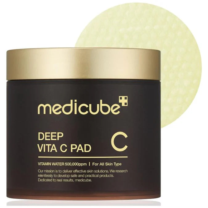 Medicube Deep Vita C Pad with a gold lid on a white background