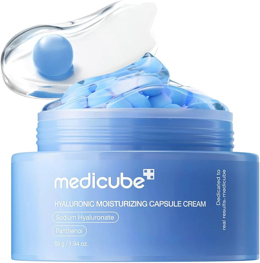 Blue jar of Medicube Hyaluronic Moisturizing Capsule Cream with a clear cap.