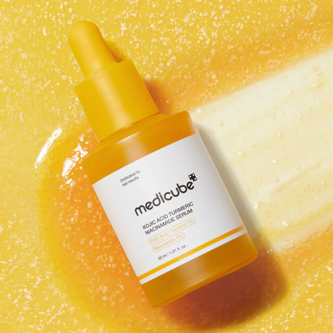 Medicube skincare serum bottle on a yellow textured background