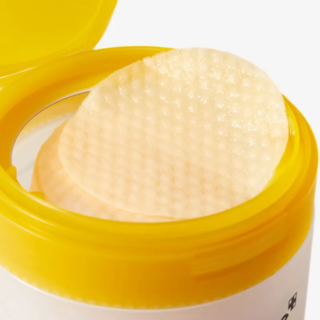Round white pad with yellow lid on a white background