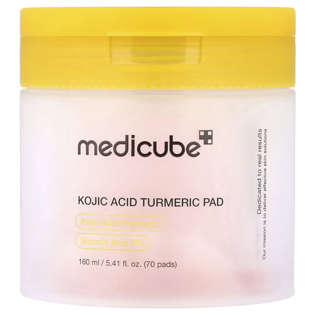 Jar of Medicube Kojic Acid Turmeric Pad with yellow lid on a white background