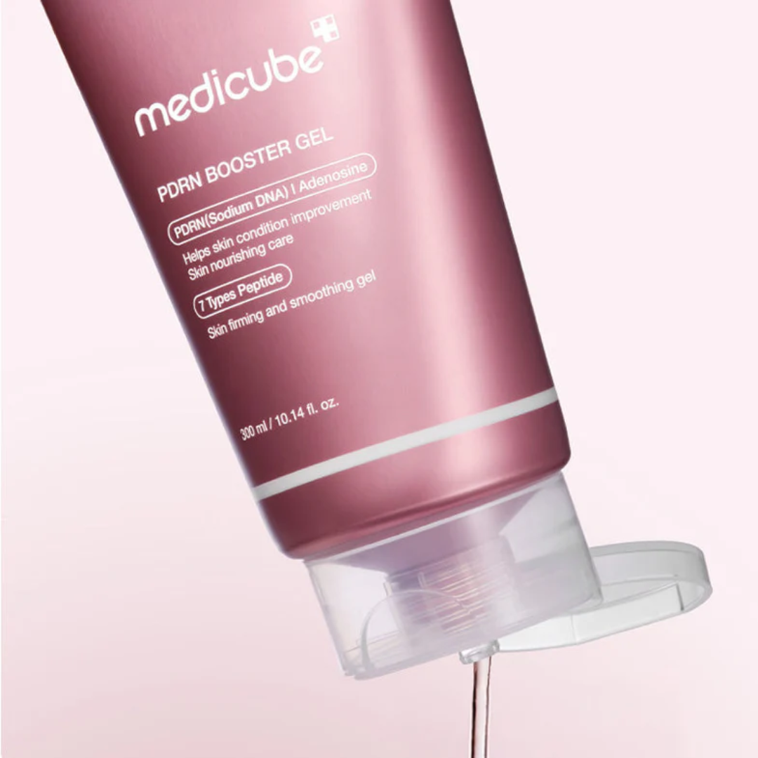 Pink bottle of Medicube PDRN Booster Gel on a light pink background