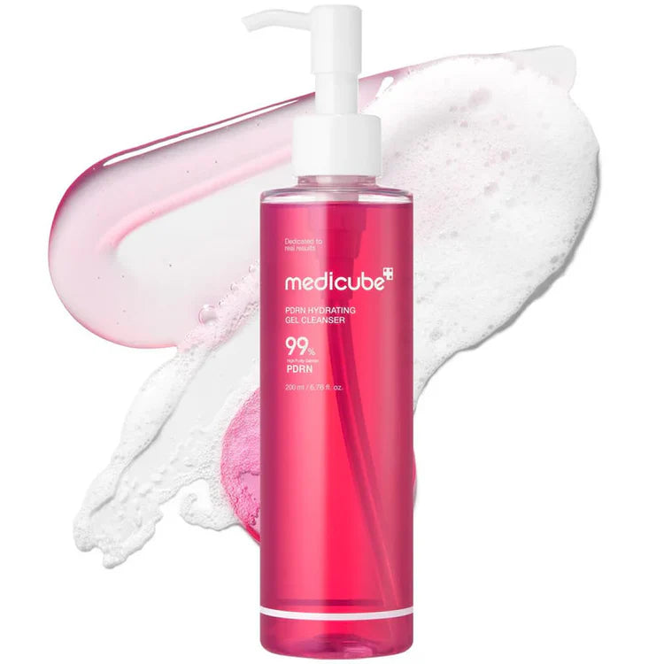 Pink bottle of Medicube gel cleanser with white pump on a white background