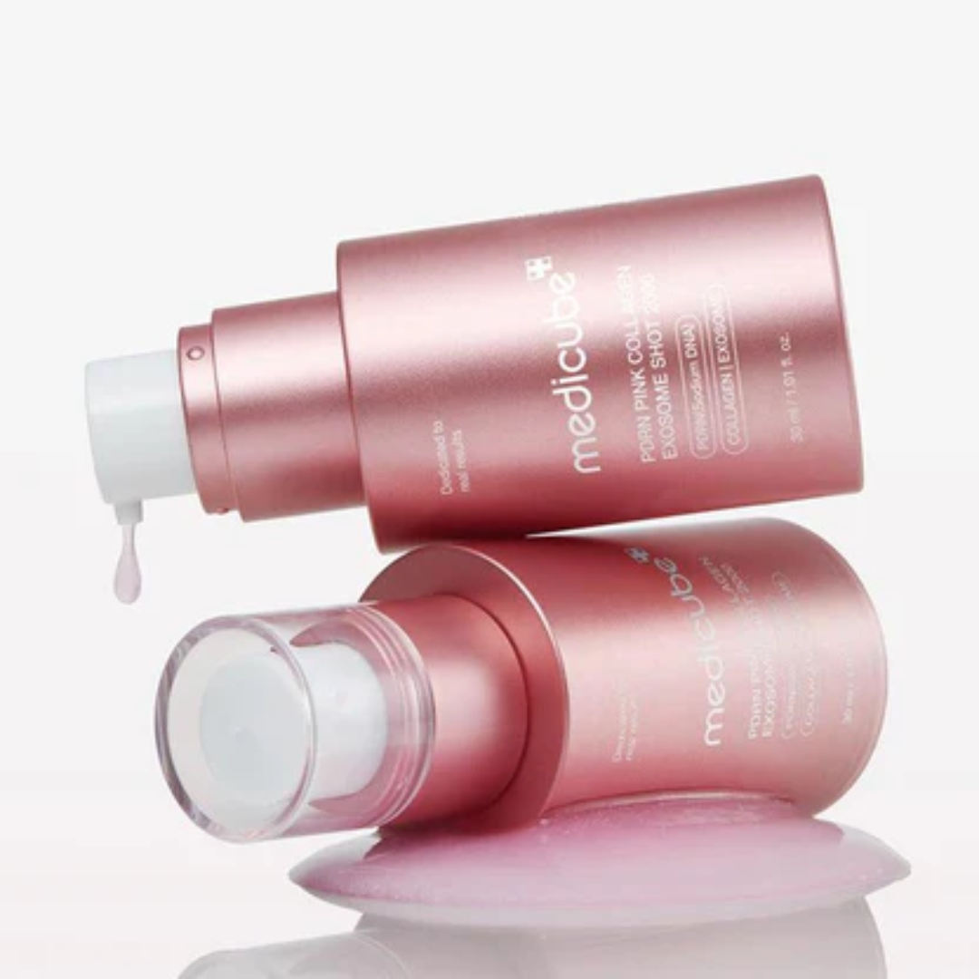 Two pink skincare bottles with 'mediclude' branding on a white background