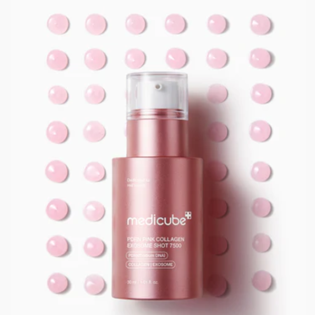 Pink skincare bottle with 'medicube' branding on a white background with pink dots.