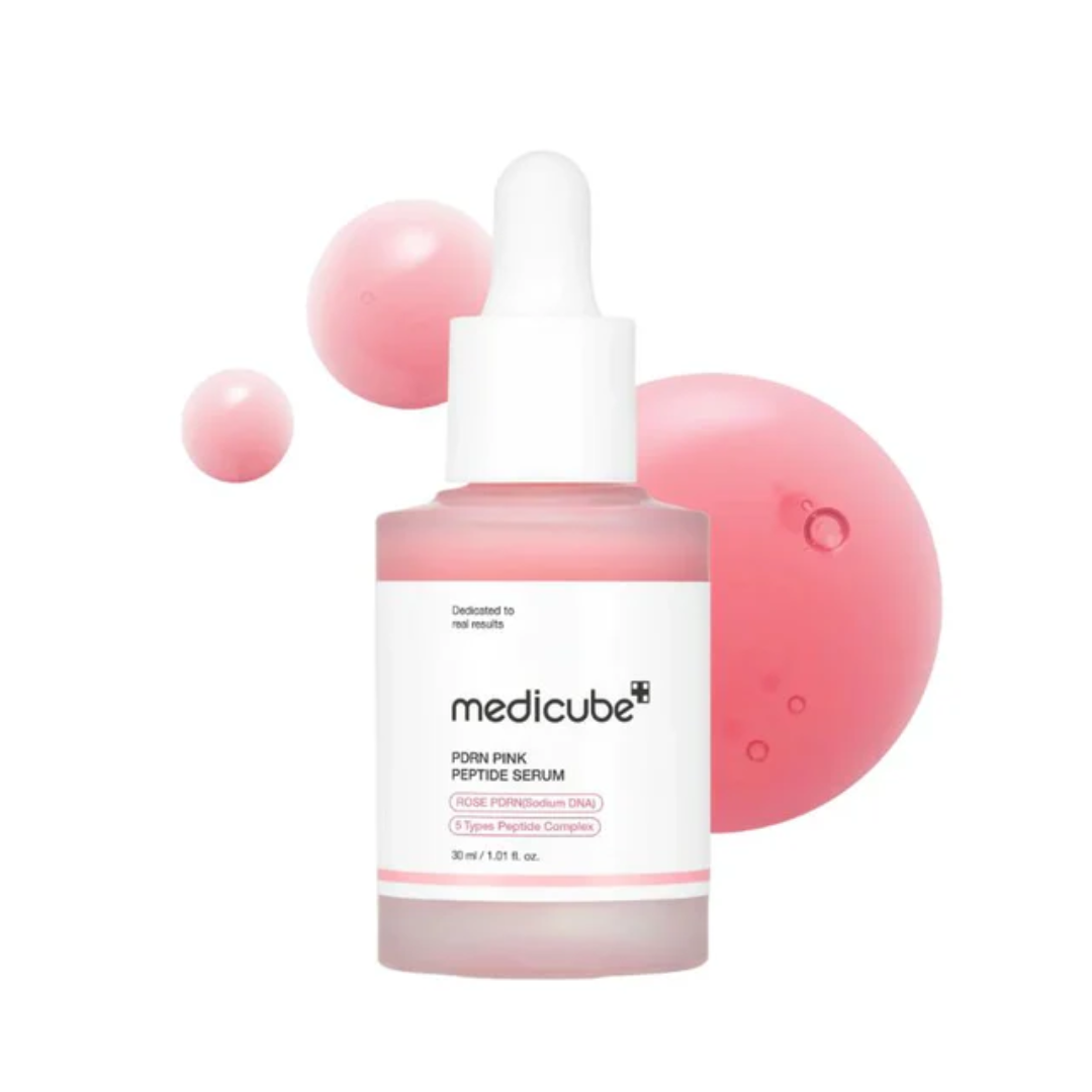 Medicube pink serum bottle with dropper on a white background