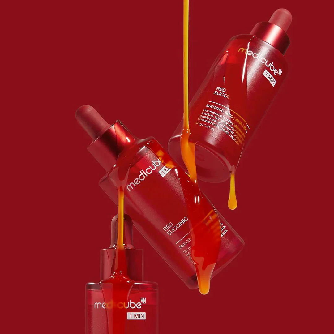 RedMediCube skincare product with droplet effect on a red background