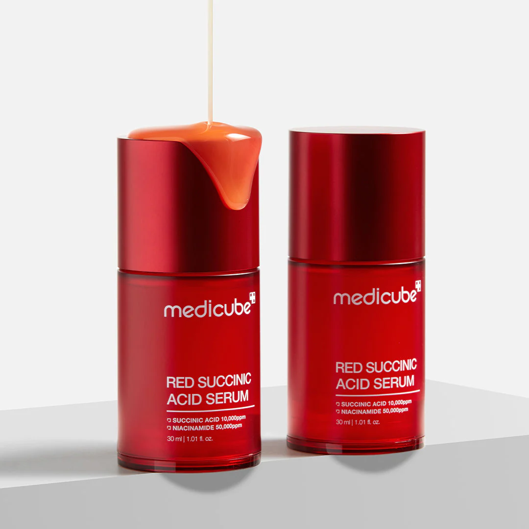 Two red bottles of Medicube Red Succinic Acid Serum on a white background