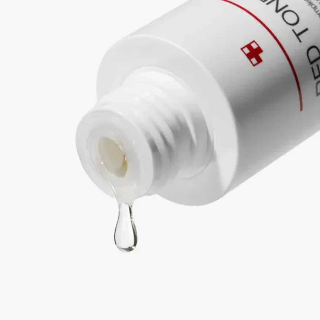 White dropper bottle with a red cross logo on a white background