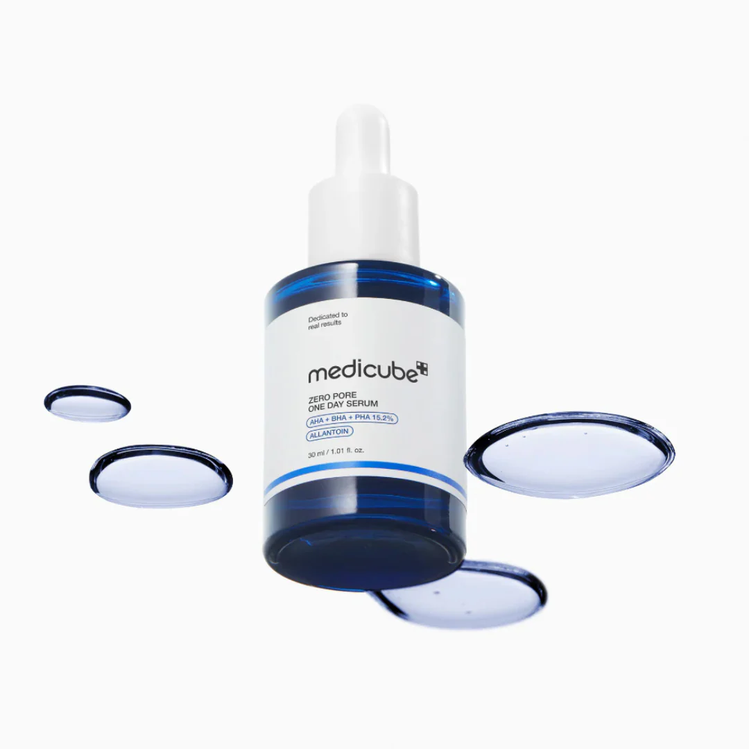 Medicube serum bottle with blue cap on a white background
