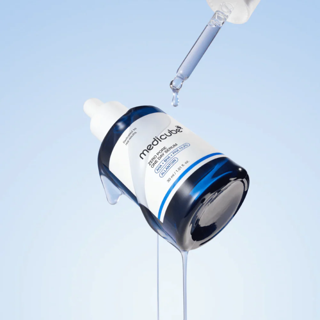 Medicube skincare product with dropper on a light blue background