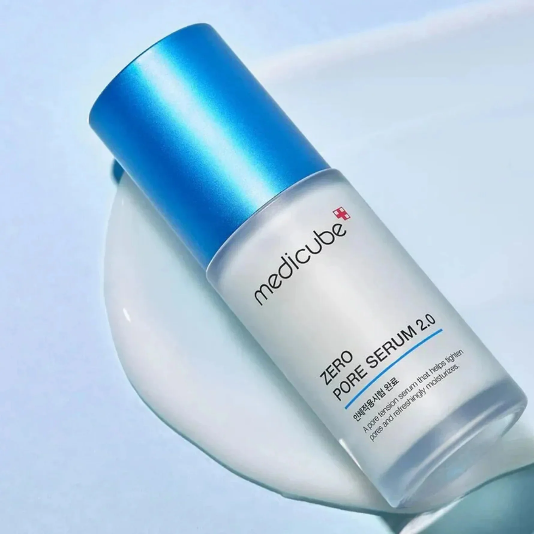 Medicube Zero Pore Serum 2.0 bottle with blue cap on a light blue background