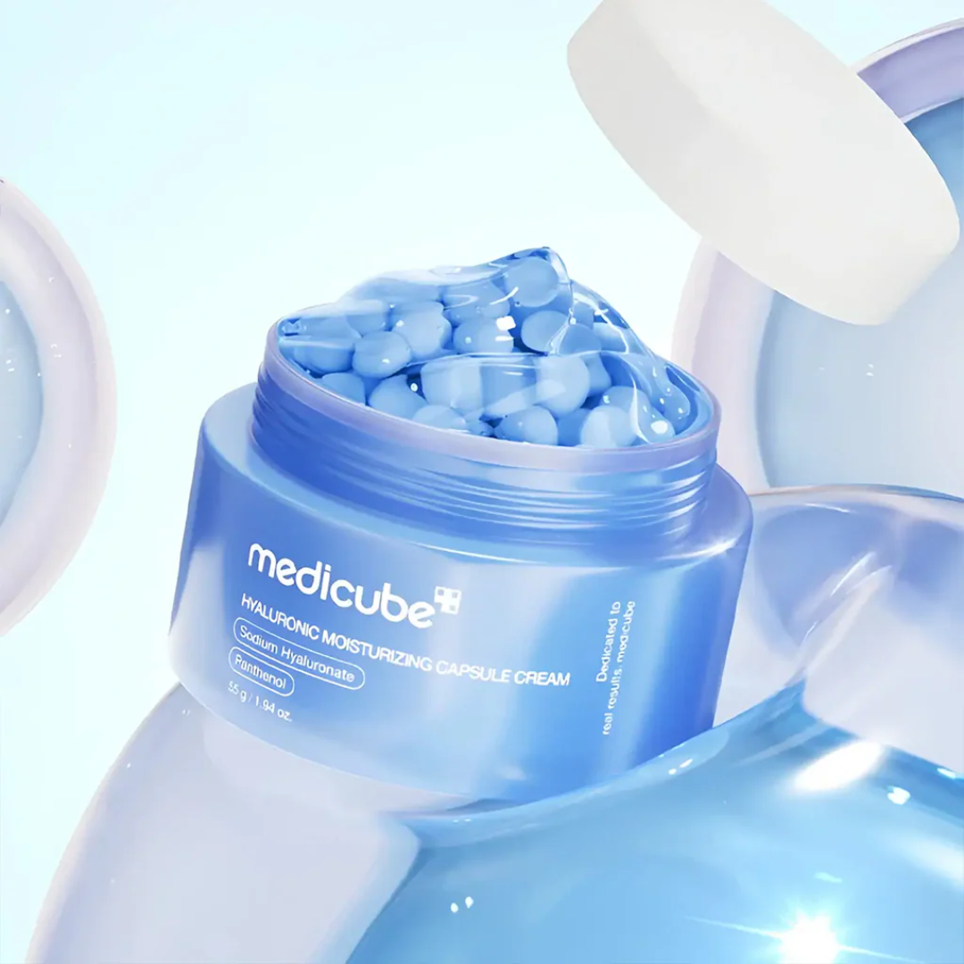 Blue skincare product container with 'medicube' branding on a light blue background