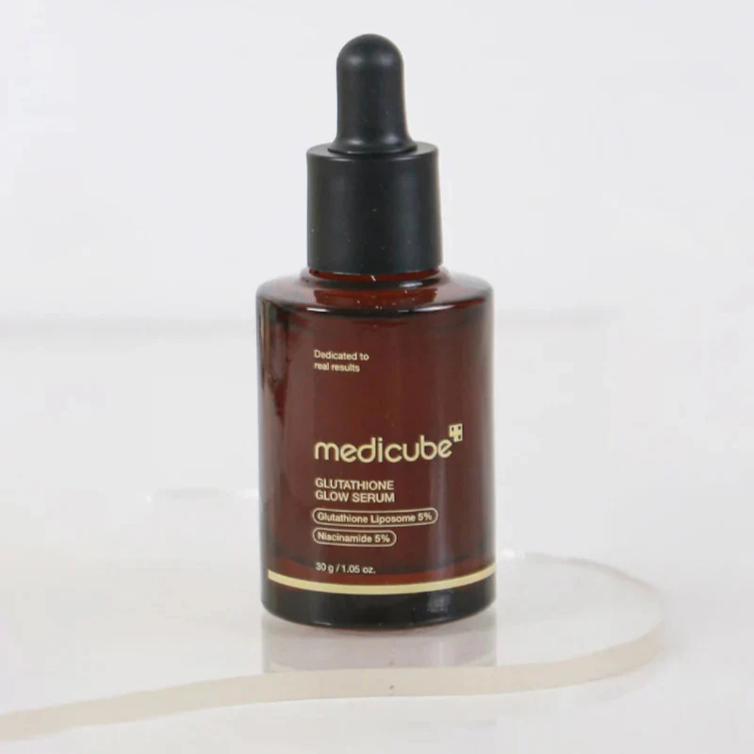 Brown serum bottle with dropper labeled 'medicube' on a white background