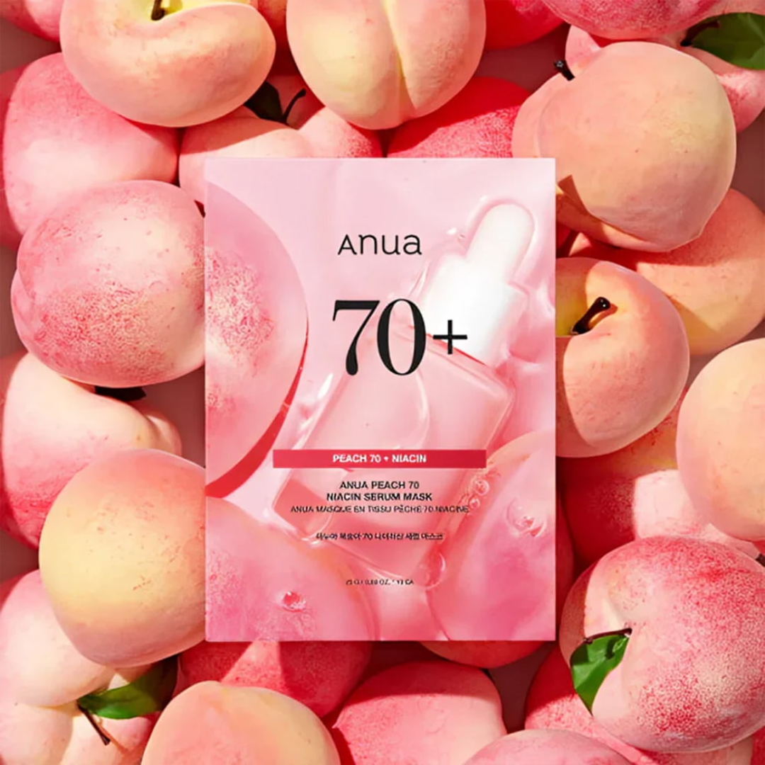 Anua peach 70+ serum mask packaging surrounded by peaches