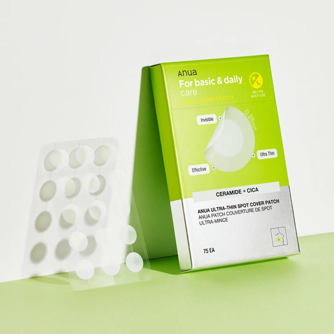 Green box of ANUA spot cover patches with white spots on a light green background